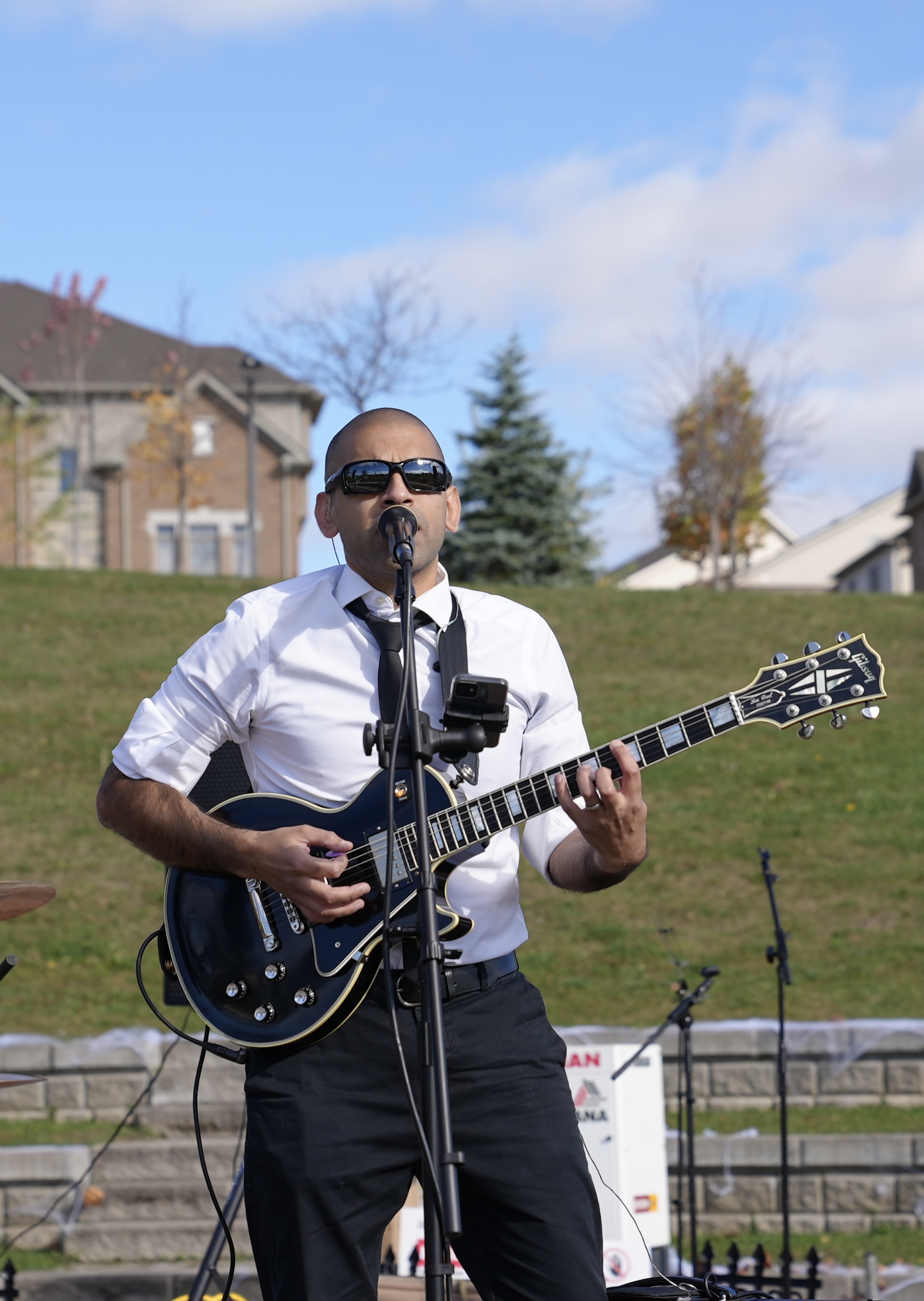Rol on guitar and vocals at outdoor festival